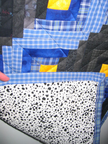 Dog print on back of mini log cabin quilt 1