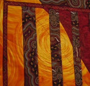 Sun - free motion embroidered in metallic gold thread