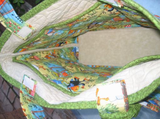 Tote bag: Inside pockets and base; velcro closures