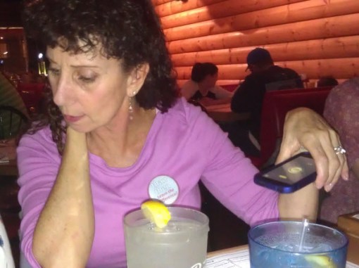It was dim, so Sue used her phone's flashlight to illuminate her menu