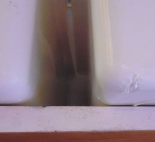 He started chewing on another tub, also 3 shelves up and nothing to stand on. It's clear he's attacking it from outside, not inside the tub.