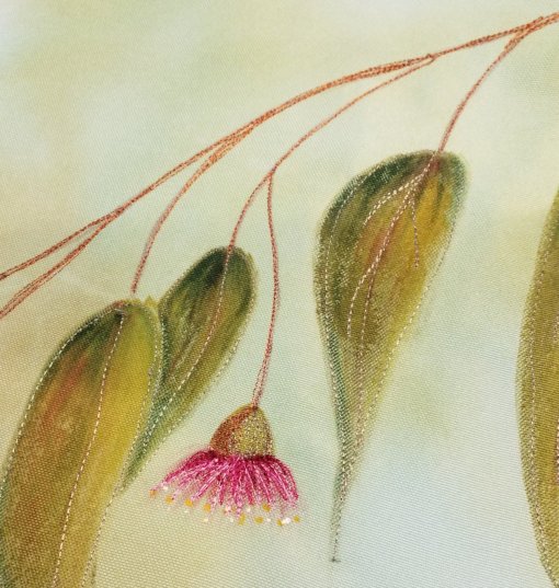 I stitched the outlines and central veins of the painted leaves, the flowers, and the small branches