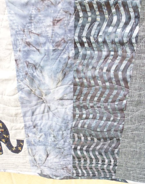 Another picture showing the quilting. You can just see the tiny elephants on the fabric used for the appliqued elephants.