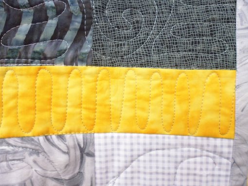 I stitched continuous 'u' shapes in the yellow strips. They have no particular meaning.