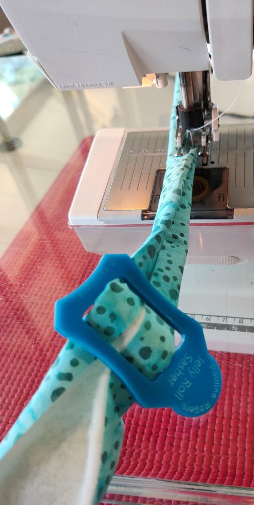 The Jelly Roll Sasher helps keep the fold in place