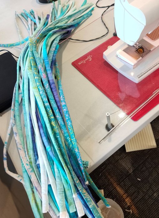 The jelly roll 'dreadlocks'. Eventually you'll have 40 to 42 individually sewn strips.