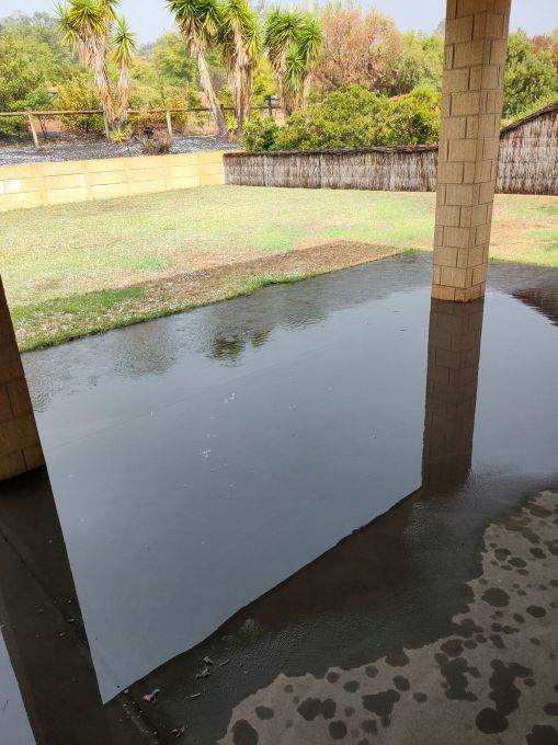 Minor flooding on the back verandah---the water near the back lawn was about 4 cm deep, the skies had gone from dark grey to medium grey. We NEVER get water coming in past the line of the pillars.