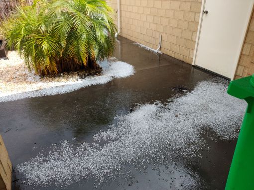 This soakwell just couldn't cope with the deluge, so the water and hailstones pooled there for several minutes. The water here was about 6 cm deep.