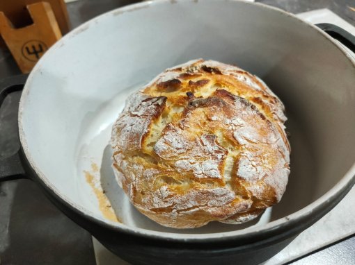 Bread fresh out of the oven and still in the cast iron dutch oven I cooked it in 